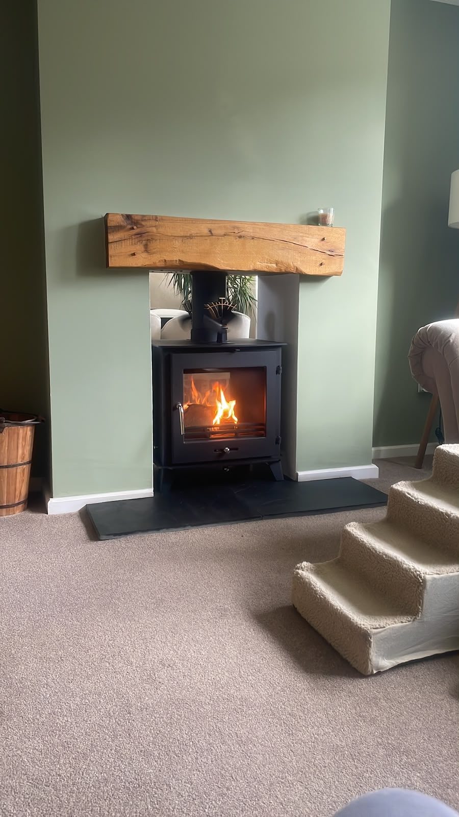 log burner with oak beam mantel