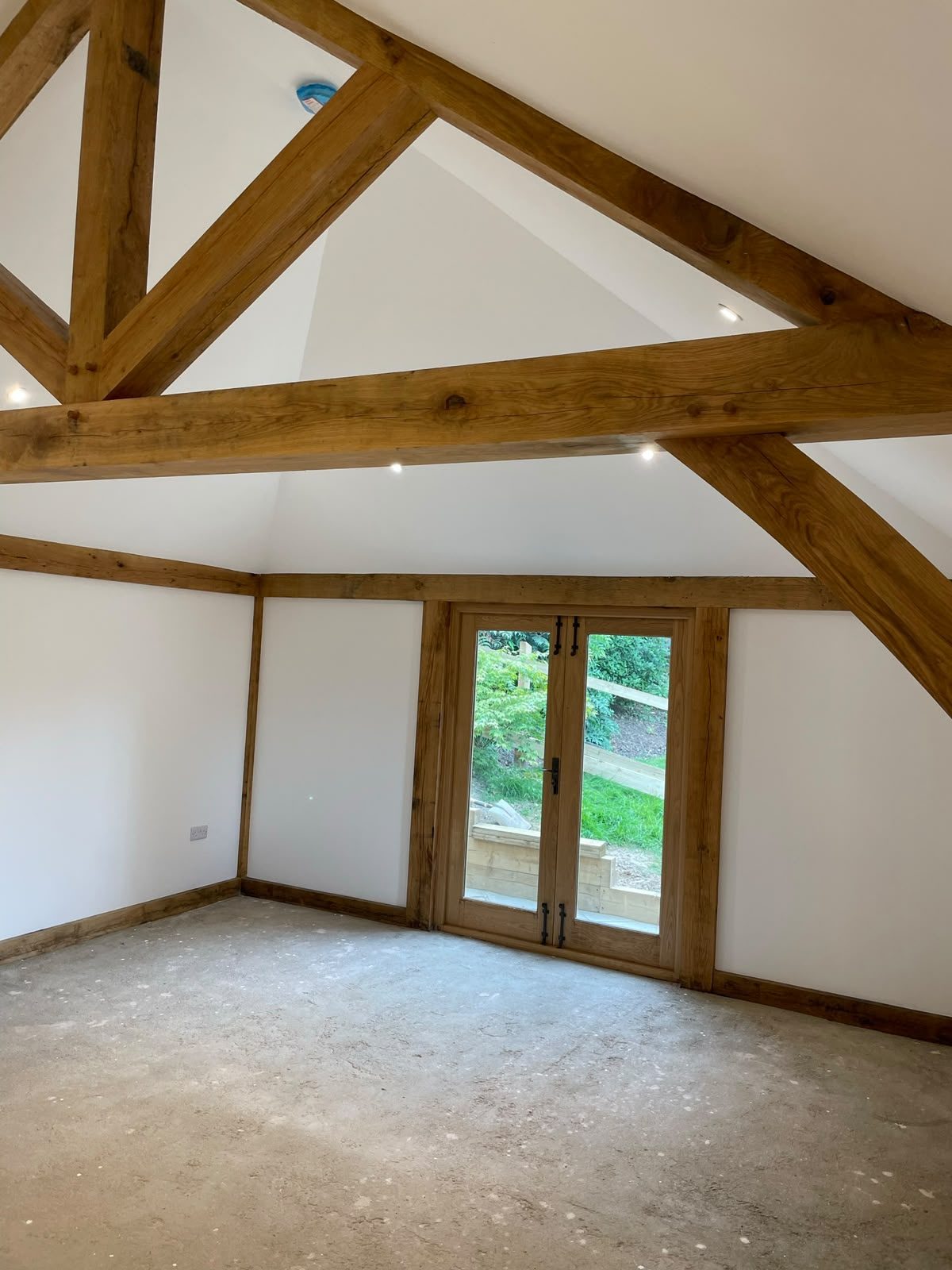 oak truss annex room with garden doors