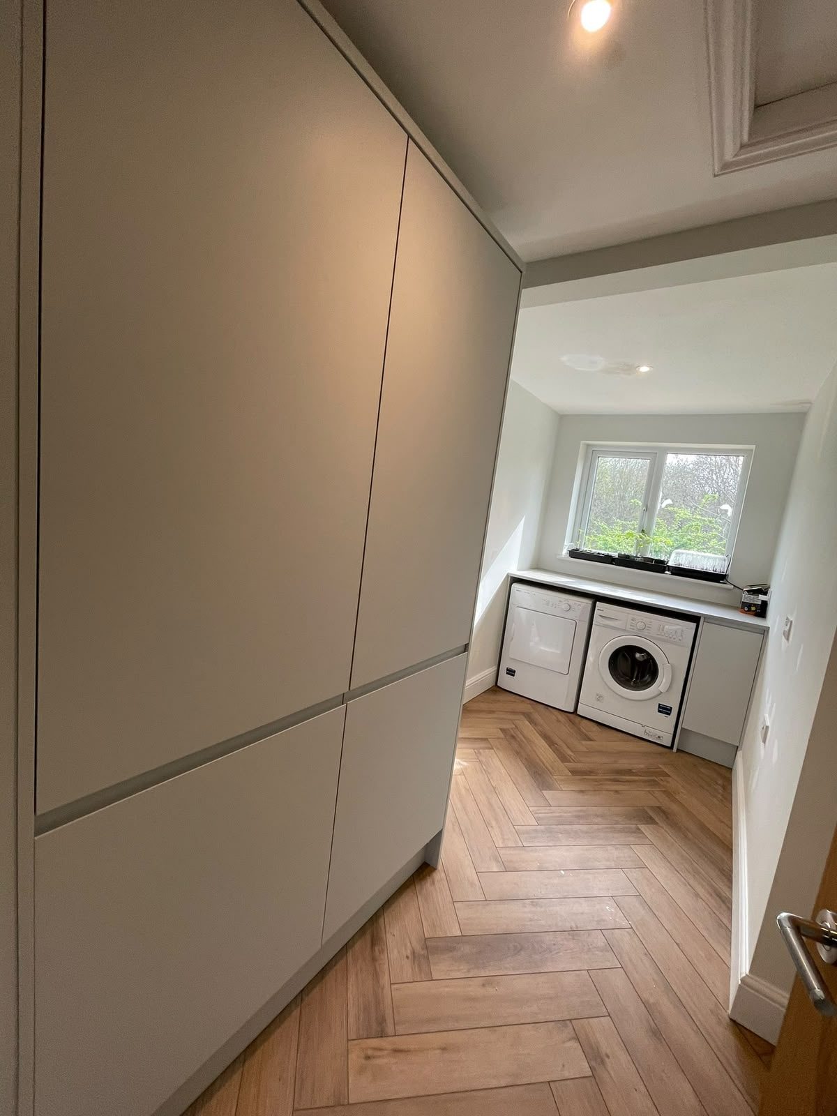 renovated utility room with fitted storage