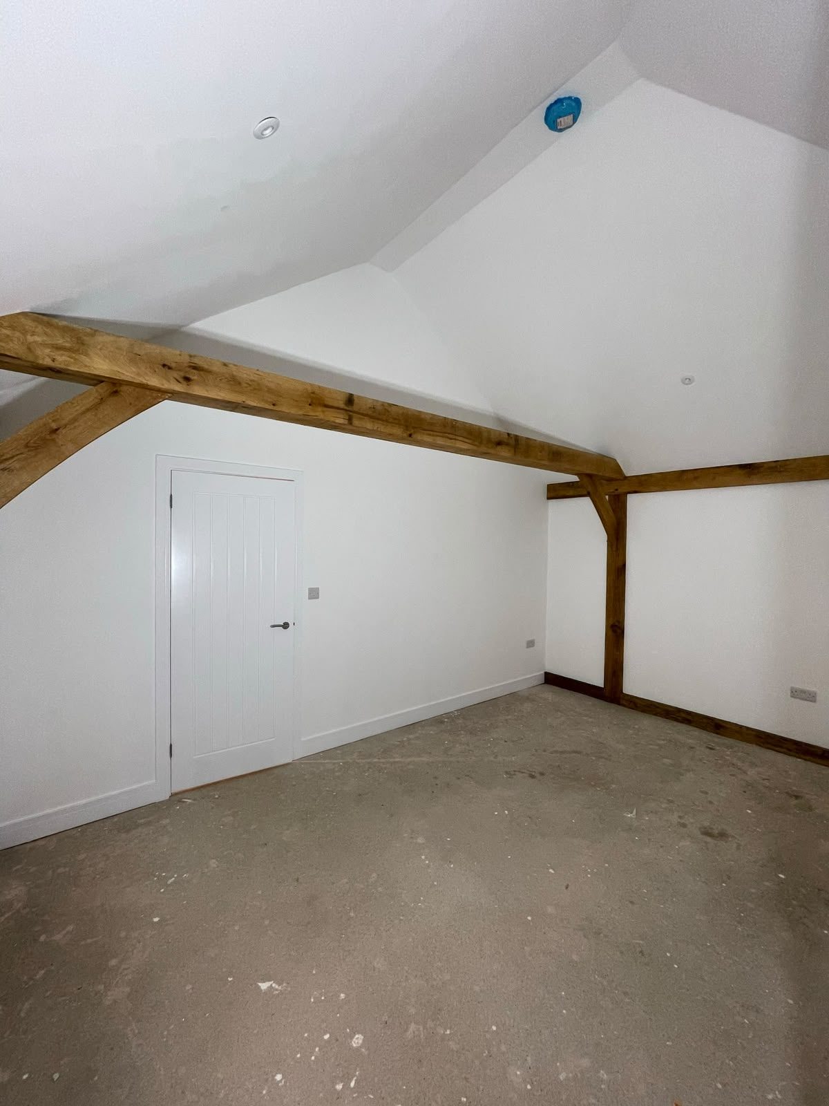 vaulted annex bedroom space with oak beam