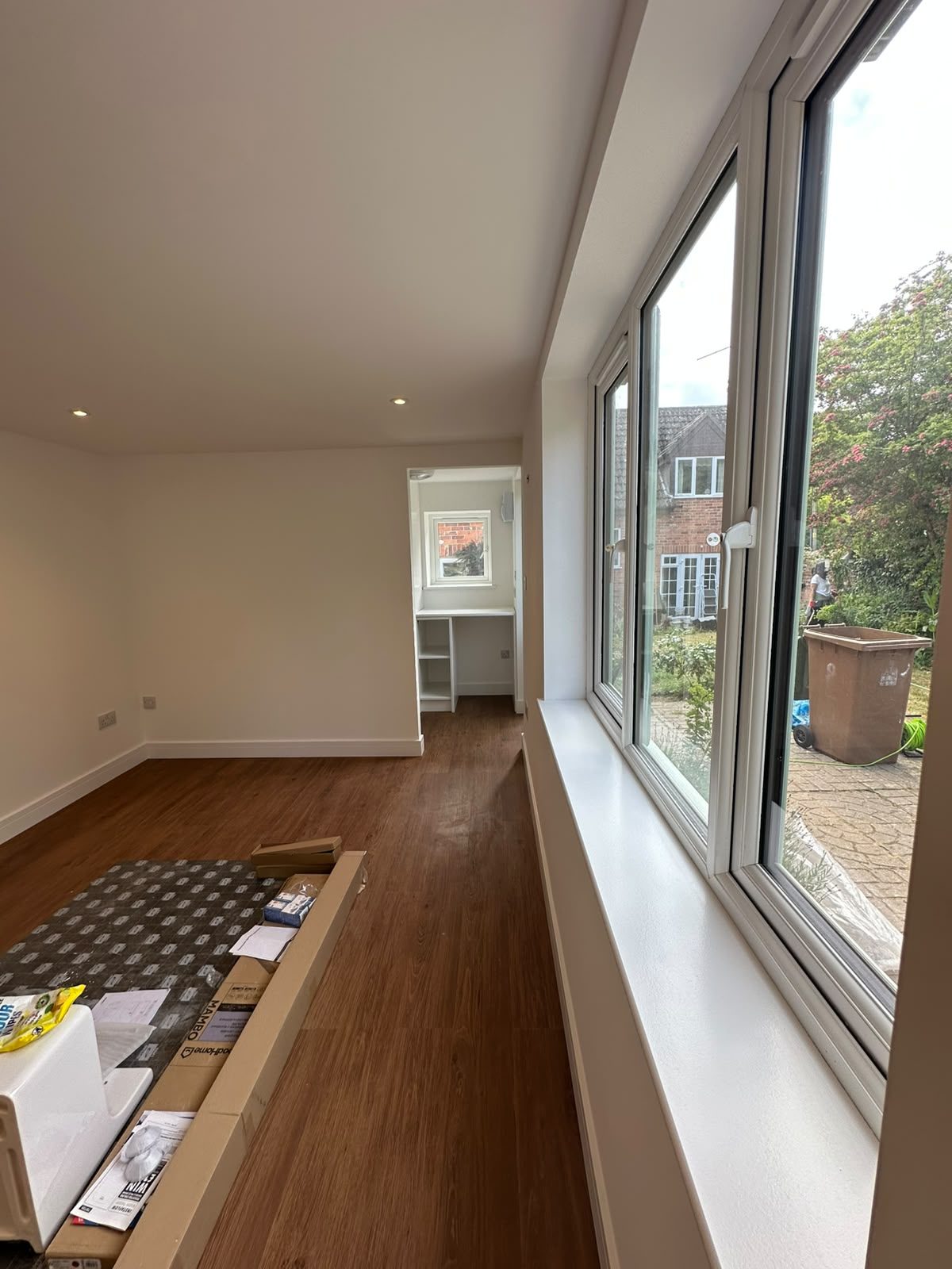 long converted garage room with new windows